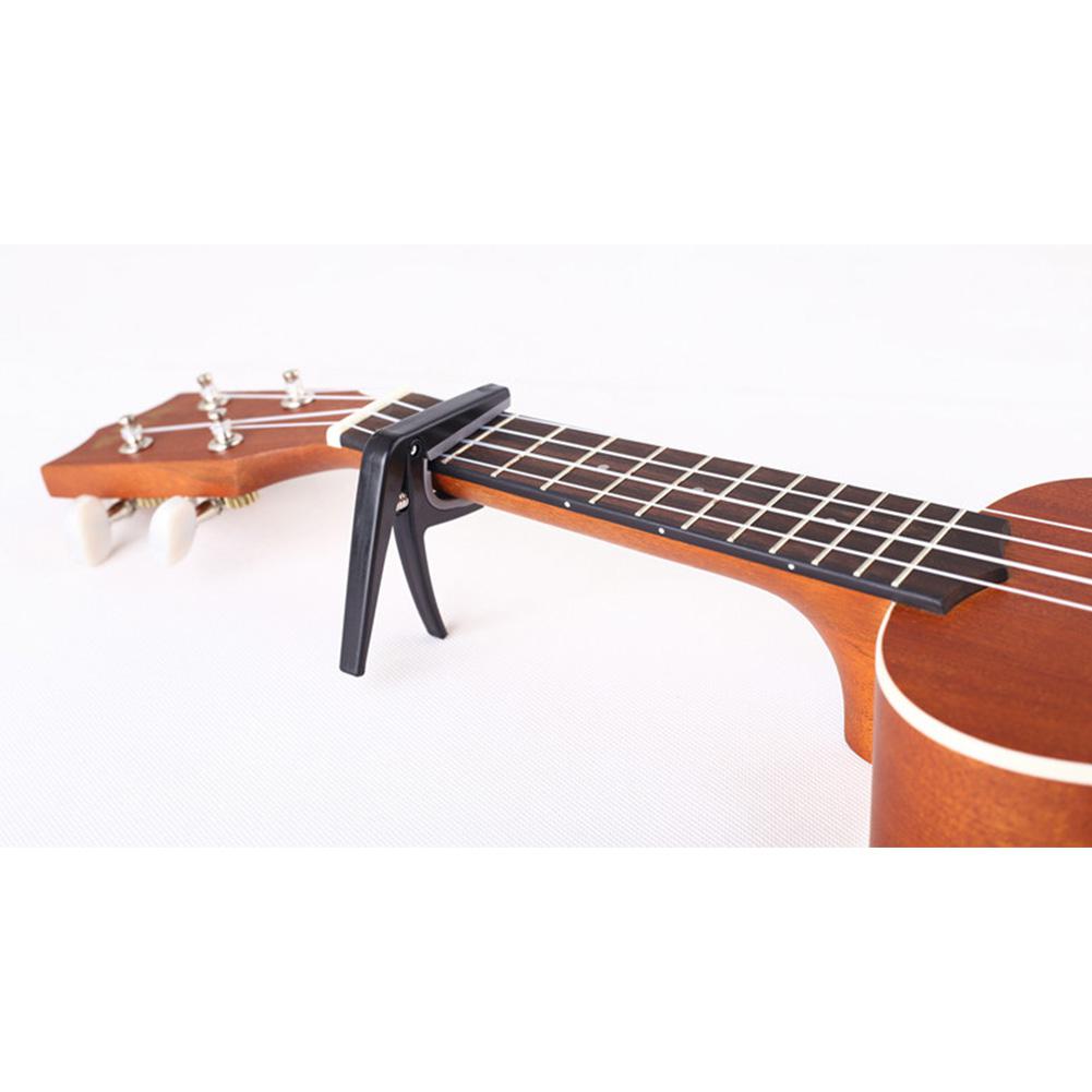 Professional Ukulele Capo Sing - Guitar Capo Clip recension och pris